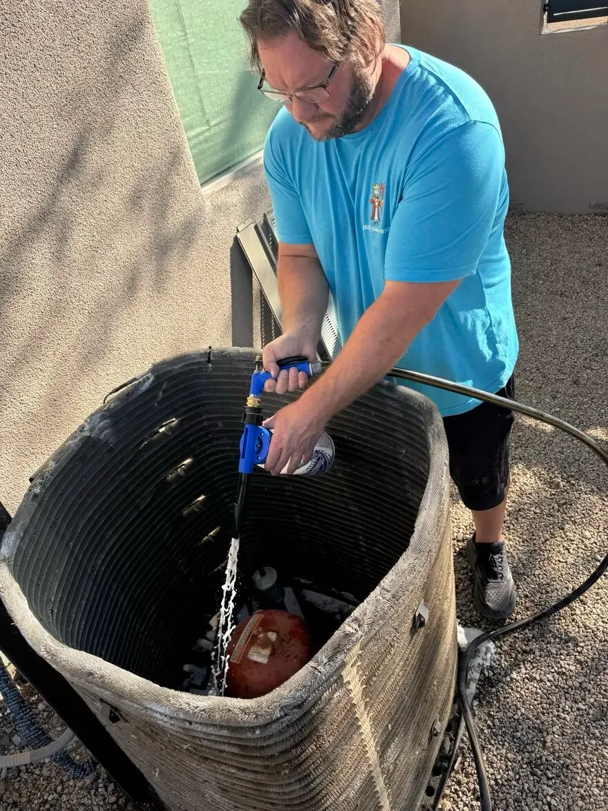 Our technician cleaning AC coils in Phoenix