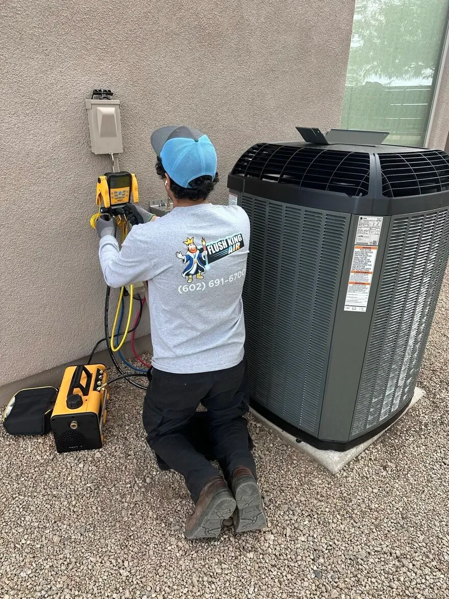 Professional technician performing AC tune-up service