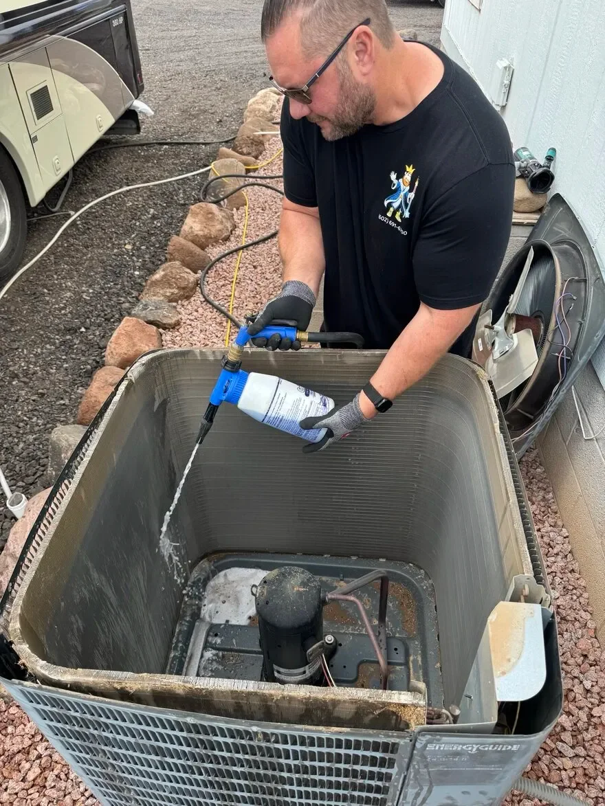 AC technician diagnosing and repairing air conditioning system