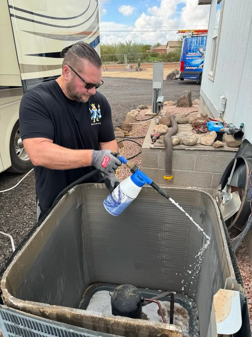 AC repair technician with service truck in Phoenix, AZ