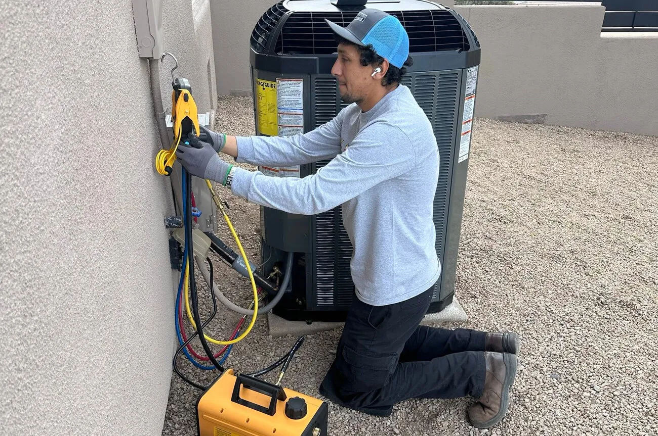 Professional AC technician performing service